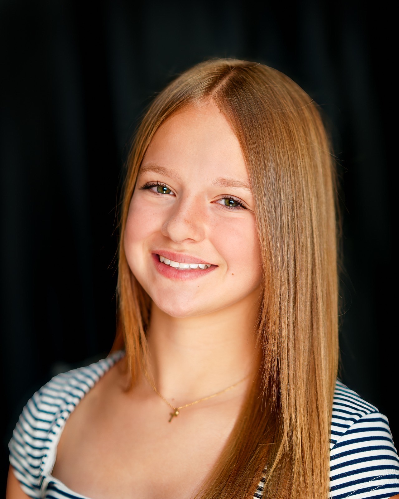 Young actor headshot on a black studio backdrop, photographed in Las Vegas