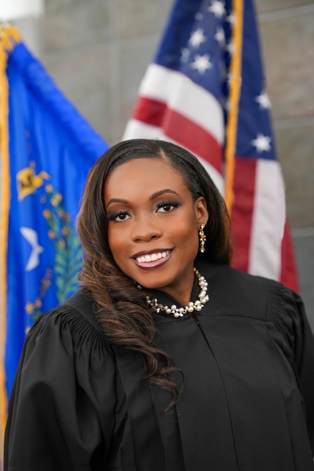 Official portrait of a judge in robes with the U.S. and Nevada flags, Las Vegas